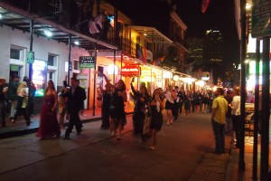 Wedding guests waving white handkerchiefs on Bourbon Street