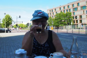 Lebensart Cafe #1 Ebertstrasse. If you look carefully, next to my left elbow there are some bricks inlaid into the paving, that's where the wall would have been, continuing on through the middle of what is now the cafe.