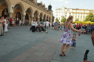 Music and dance in the main square captivate a child