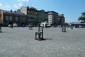 Giant chairs sculpture in the square in front of the Pharmacy Under the Eagle memorialising the Jews in the ghetto.